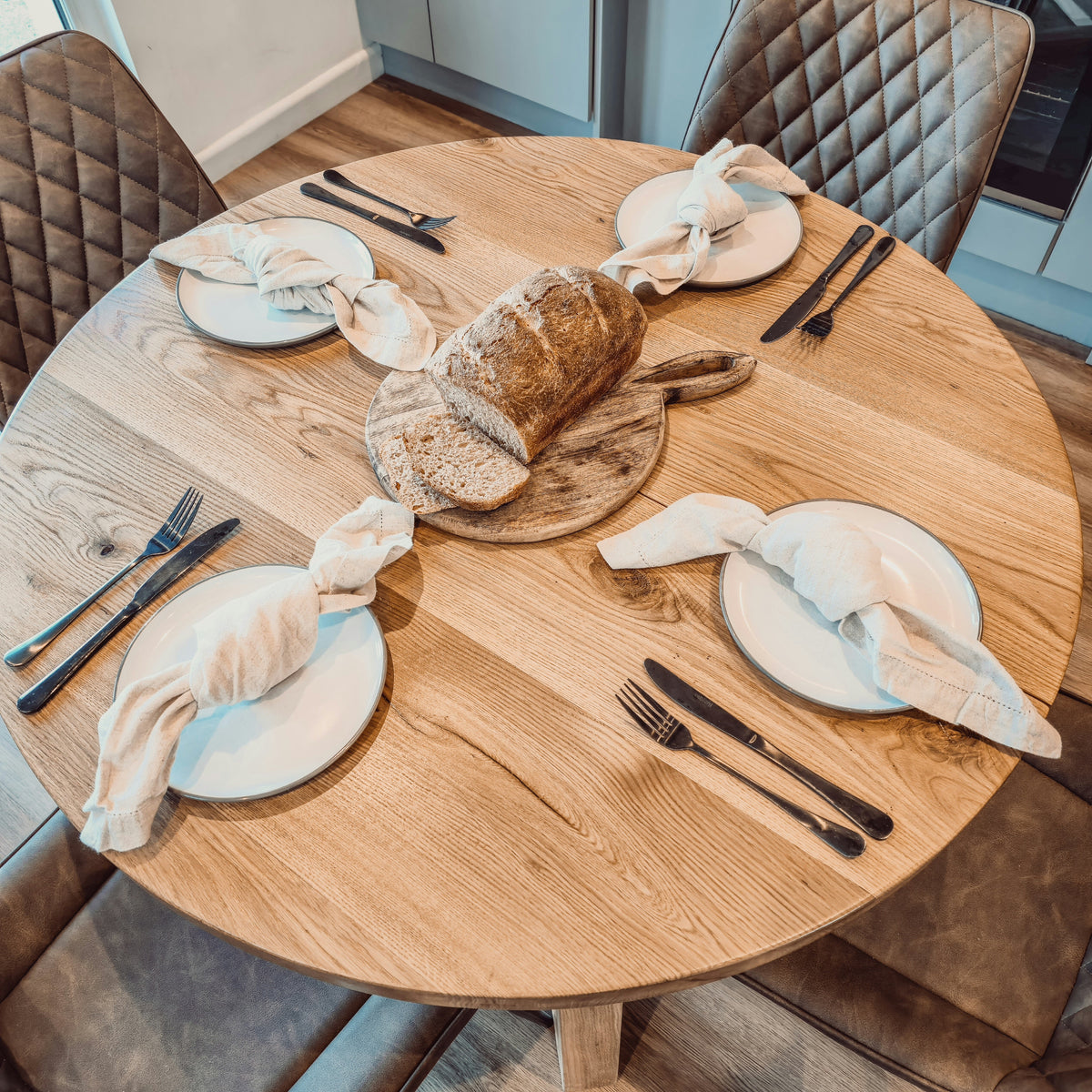 Solid Oak Round Dining Table With Wooden Legs and Leather Chairs